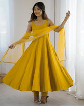 MAJESTIC YELLOW CHANDERI SILK LACE WORK FESTIVE WEAR ANARKALI SUIT