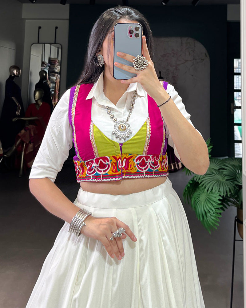 AWESOME WHITE RAYON NAVRATRI LEHENGA CHOLI WITH MULTICOLOR BORDER