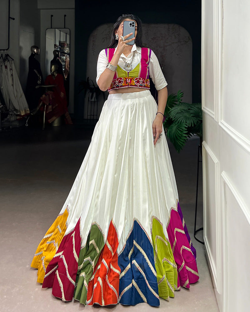 AWESOME WHITE RAYON NAVRATRI LEHENGA CHOLI WITH MULTICOLOR BORDER